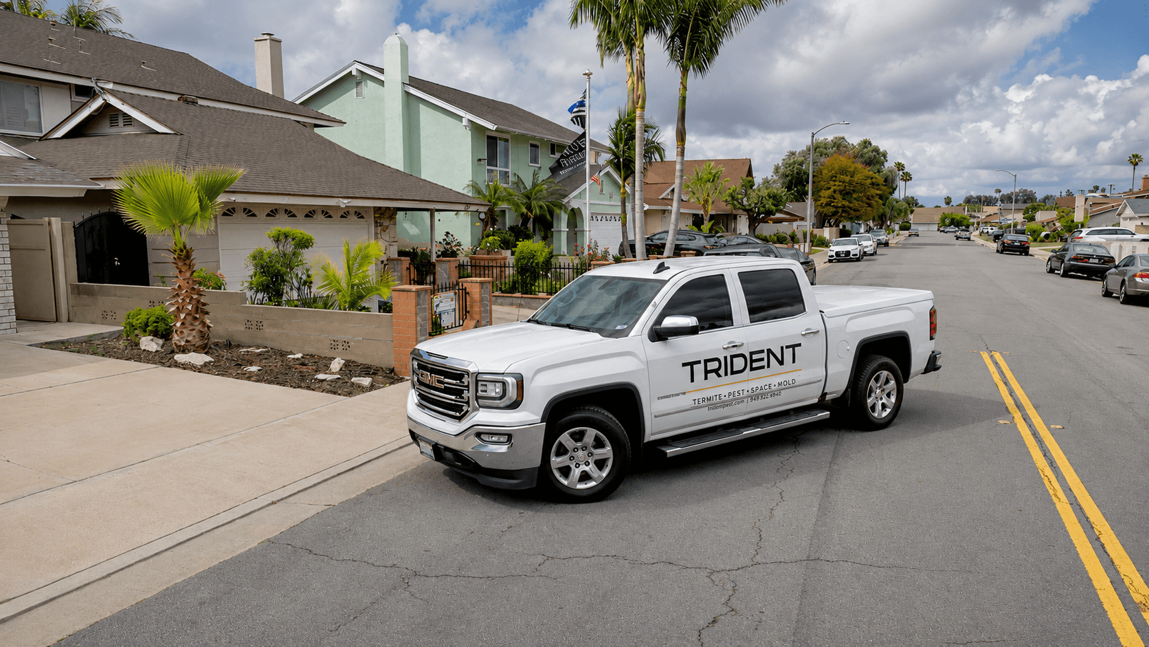 Branded Trident Pest Control service truck parked on an Orange County residential street